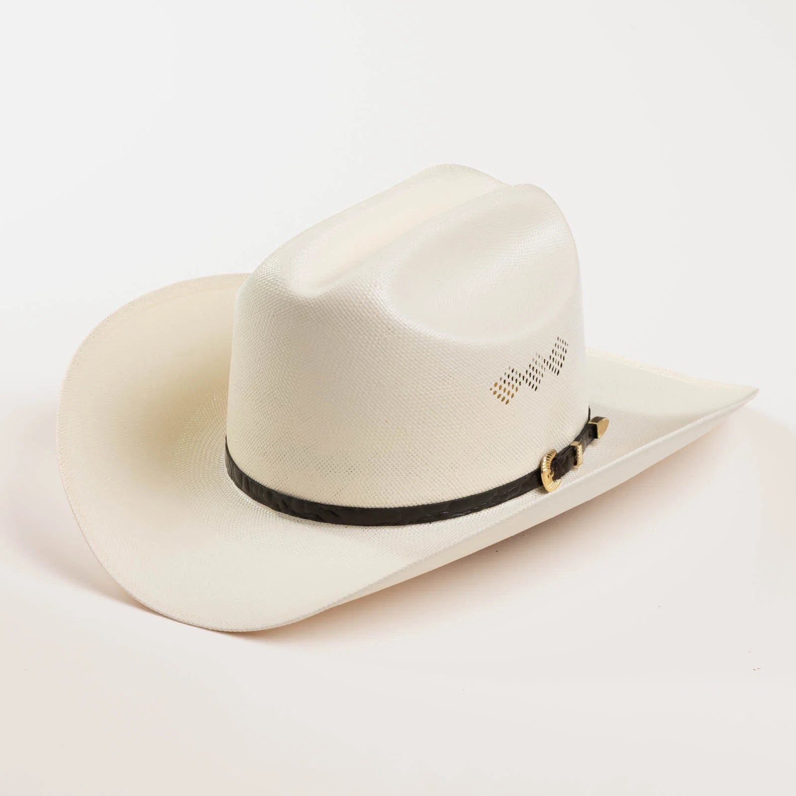 An off-white cowboy hat with a black band and gold buckle, photographed on a clean white background.