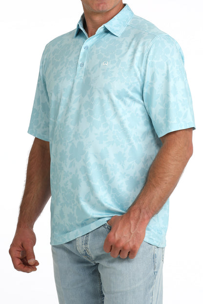 Light blue patterned polo shirt worn by a person on a white background