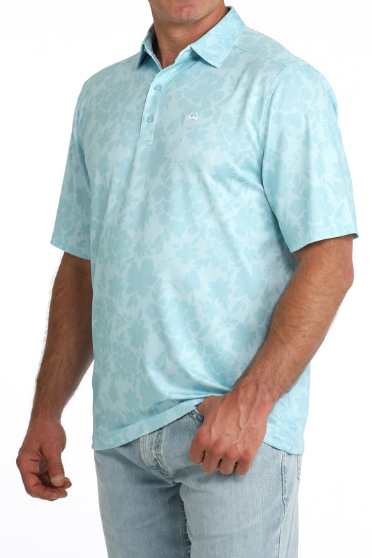 Light blue patterned polo shirt worn by a person on a white background