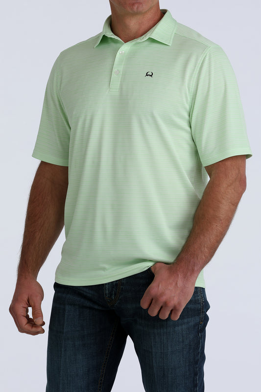 Light green polo shirt worn by a person on a white background