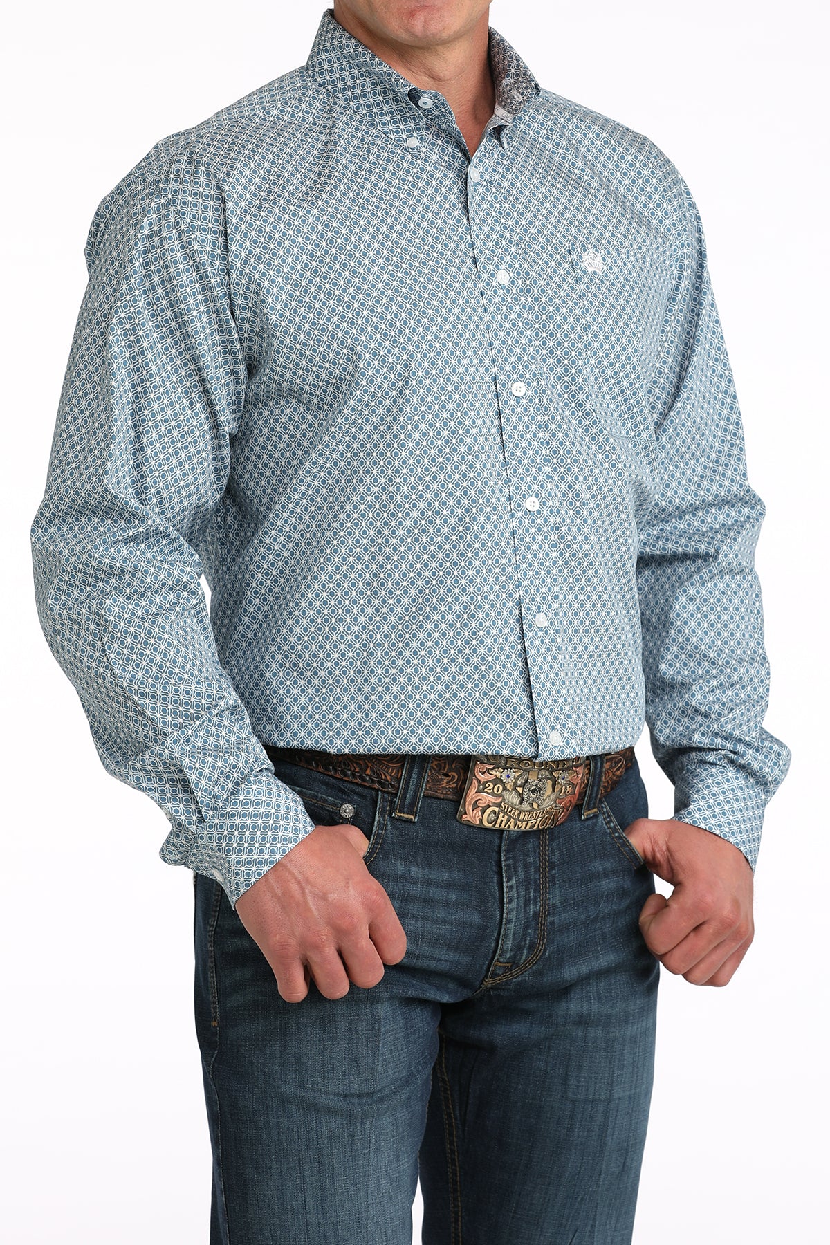 Men's long sleeve blue patterned button-up shirt with jeans and western belt