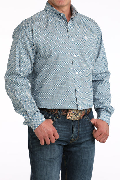 Men's long sleeve blue patterned button-up shirt with jeans and western belt