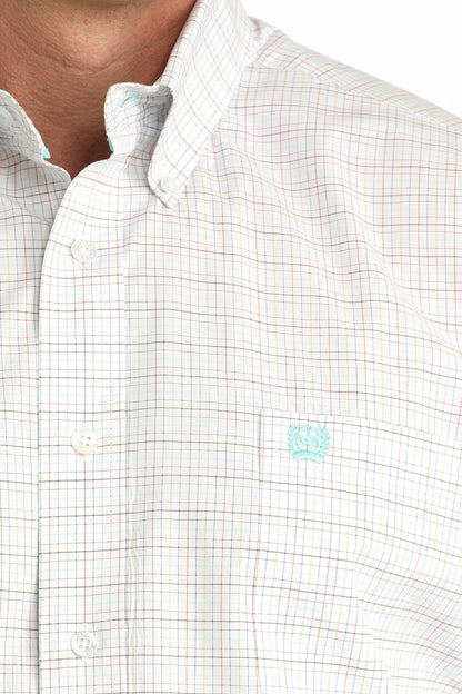 Close-up of a white checkered shirt with a small logo on the chest.