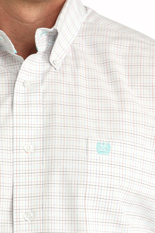 Close-up of a white checkered shirt with a small logo on the chest.
