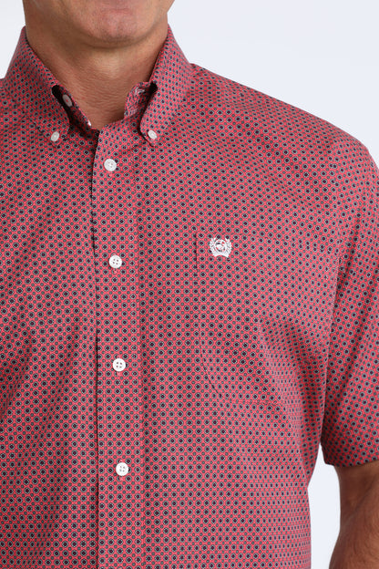 Red patterned shirt worn by a person on a white background