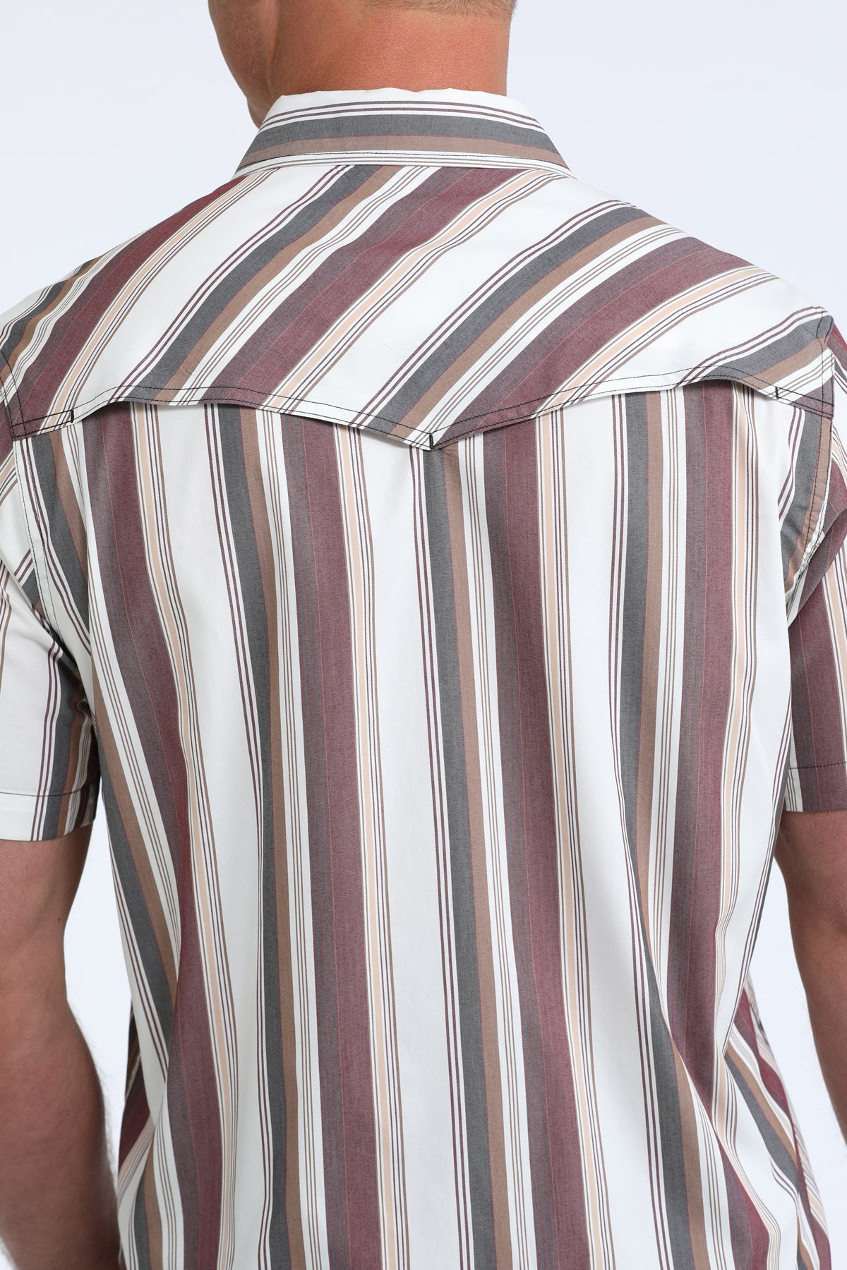 Close-up of a striped shirt with a neutral background