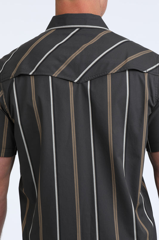 Close-up of a black pinstripe shirt on a person against a light gray background