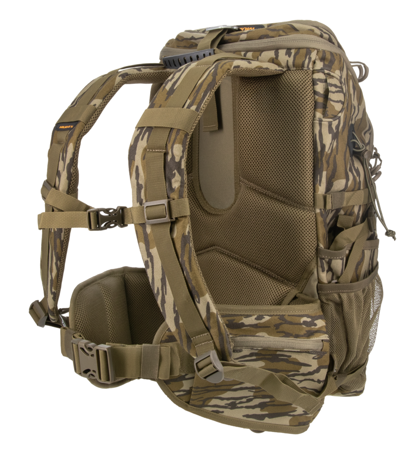 A camouflage backpack shown from the side on a clean white background, featuring a woodland camo pattern in shades of brown, tan, and green with padded shoulder straps and side pockets.
