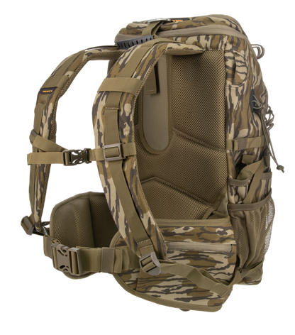 A camouflage backpack shown from the side on a clean white background, featuring a woodland camo pattern in shades of brown, tan, and green with padded shoulder straps and side pockets.