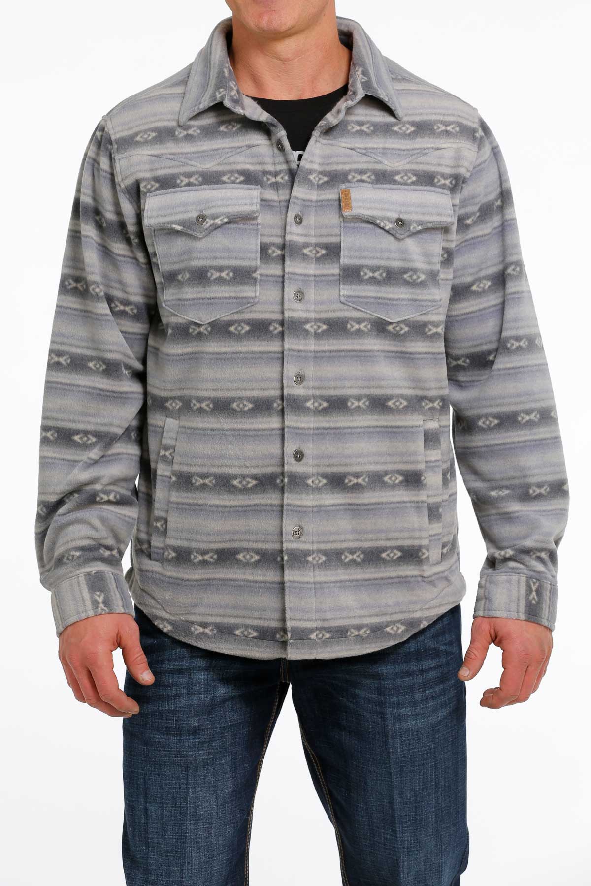 Men's grey patterned button-up shirt with chest pockets, worn with blue jeans