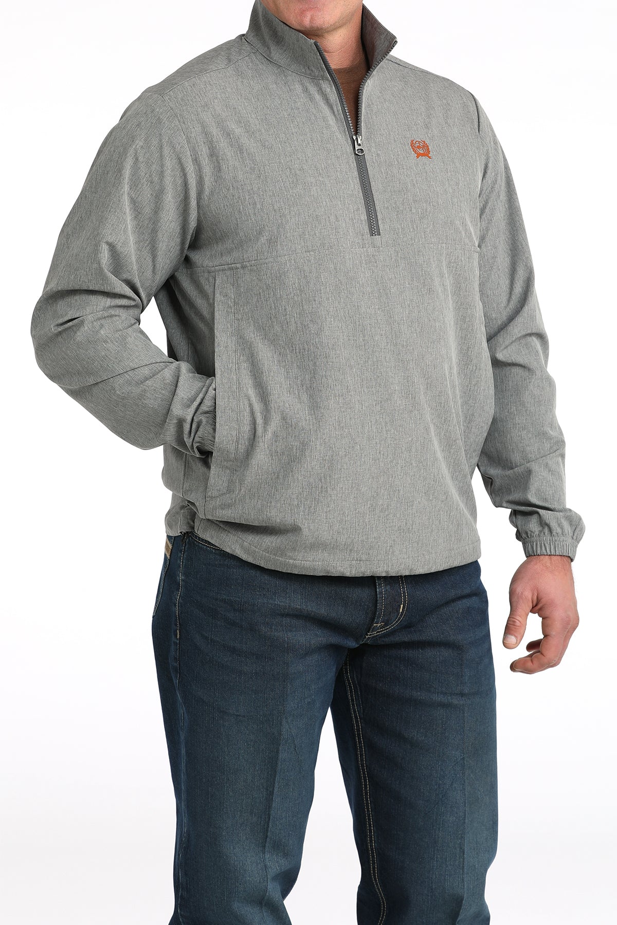 Man wearing a gray quarter-zip pullover jacket with jeans, front view on white background