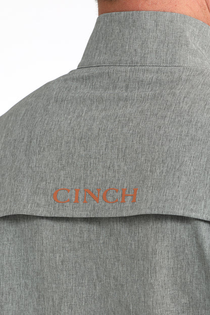 Close-up of men's gray button-up shirt back with CINCH logo on yoke