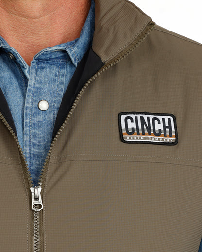 green vest with CINCH logo