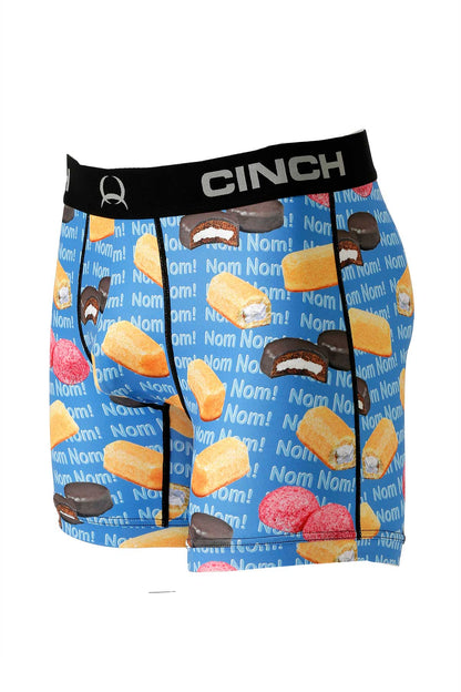 Men's blue boxer briefs with snack cake and 'Nom Nom!' print, black elastic waistband