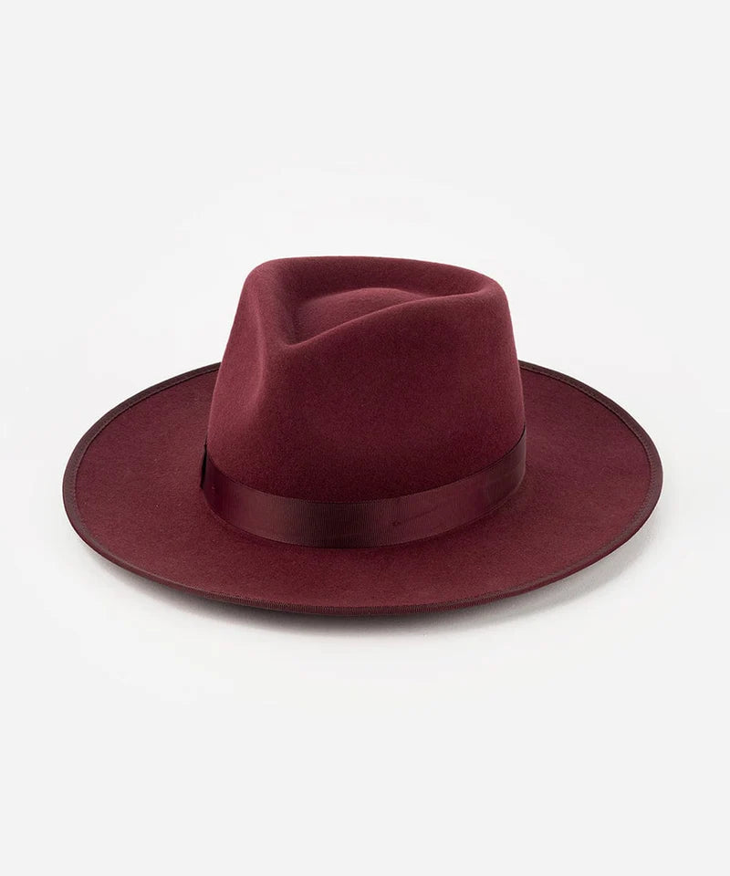Merlot burgundy felt fedora hat with wide brim and ribbon band on white background