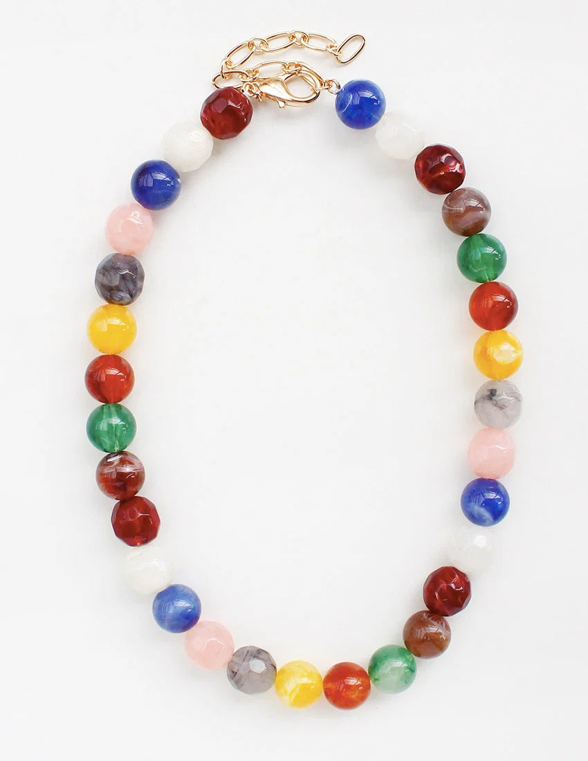 Colorful beaded necklace with a gold clasp on a white background