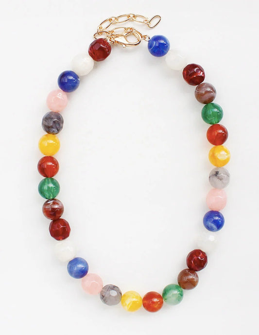 Colorful beaded necklace with a gold clasp on a white background