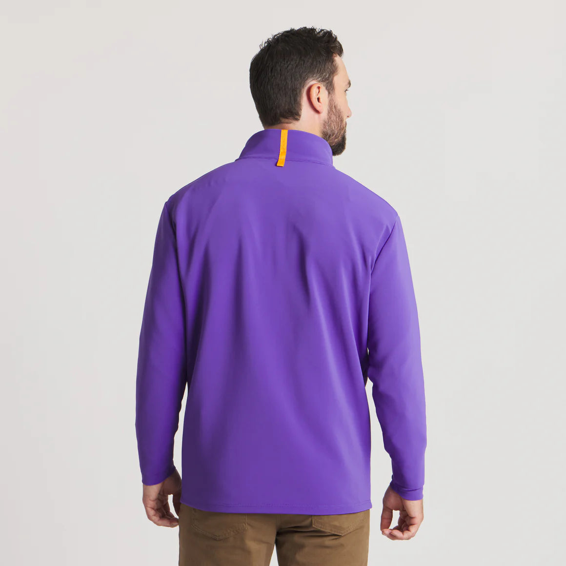 Man wearing a purple long sleeve pullover with yellow accent on collar, back view