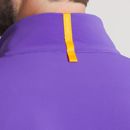 Close-up of a purple shirt collar with an orange fabric loop detail