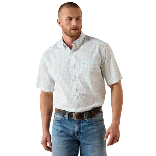 Man wearing a white short-sleeve shirt with a subtle pattern and blue jeans on a white background