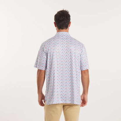 Man wearing a patterned short-sleeve shirt on a white background