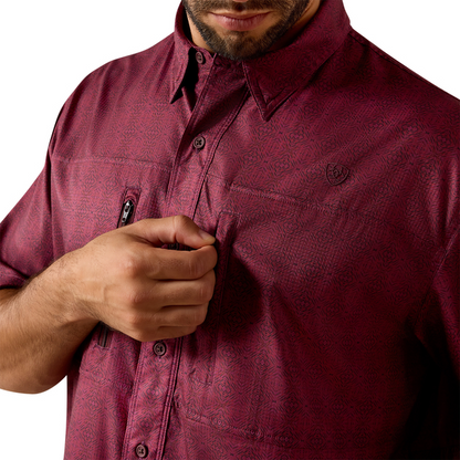 Maroon men's short sleeve button-up shirt with subtle print and chest zipper pocket.