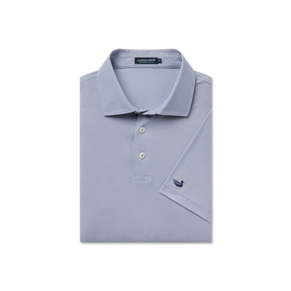 Folded light gray polo shirt with a small logo on a white background