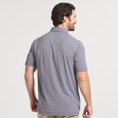 Man wearing gray short-sleeve polo shirt, back view, casual outfit