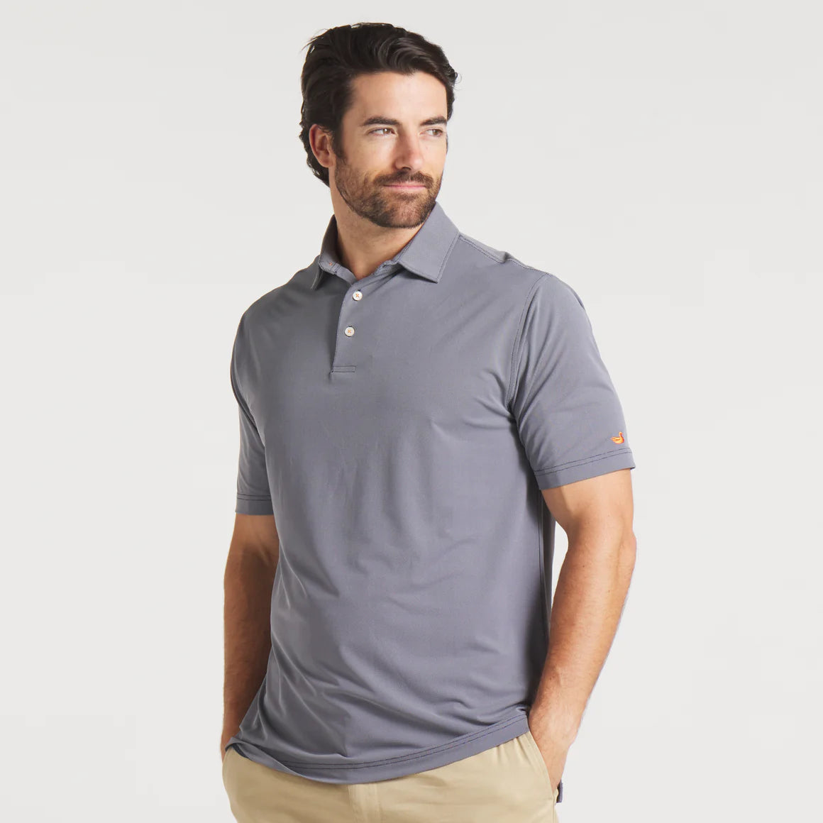 Man wearing short-sleeve gray polo shirt and khaki pants, casual men's outfit