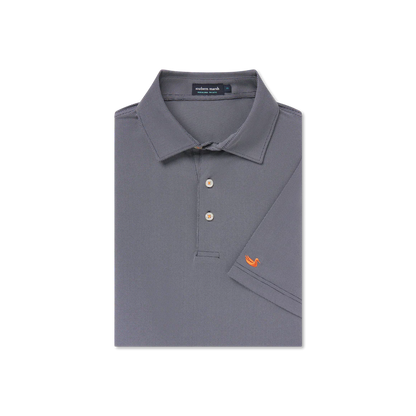 Folded navy blue polo shirt with button collar and orange duck logo on sleeve