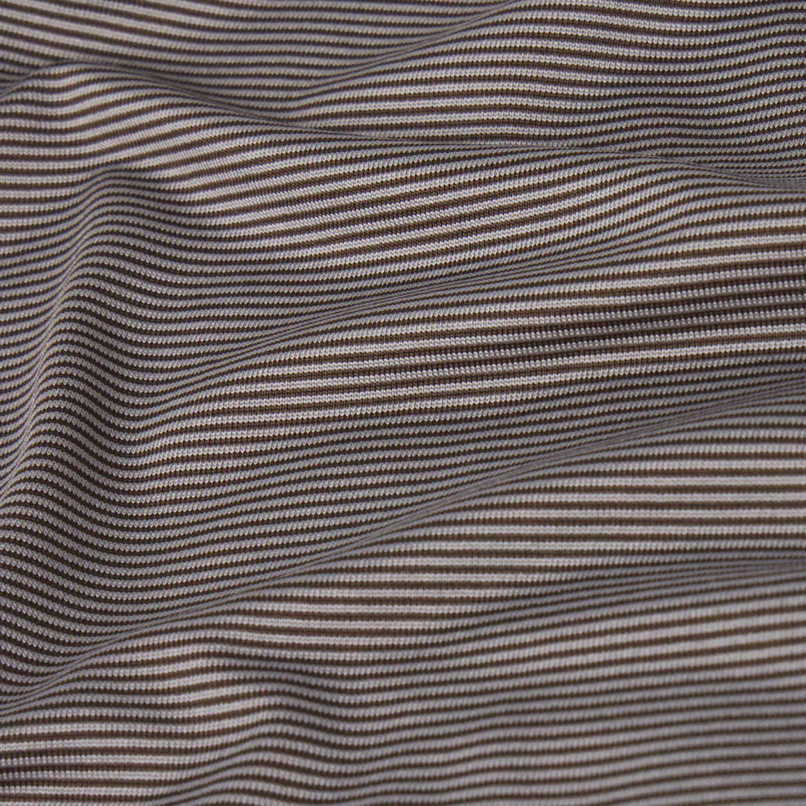 Wavy patterned fabric with alternating dark and light lines
