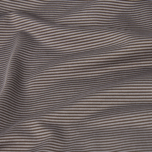 Wavy patterned fabric with alternating dark and light lines