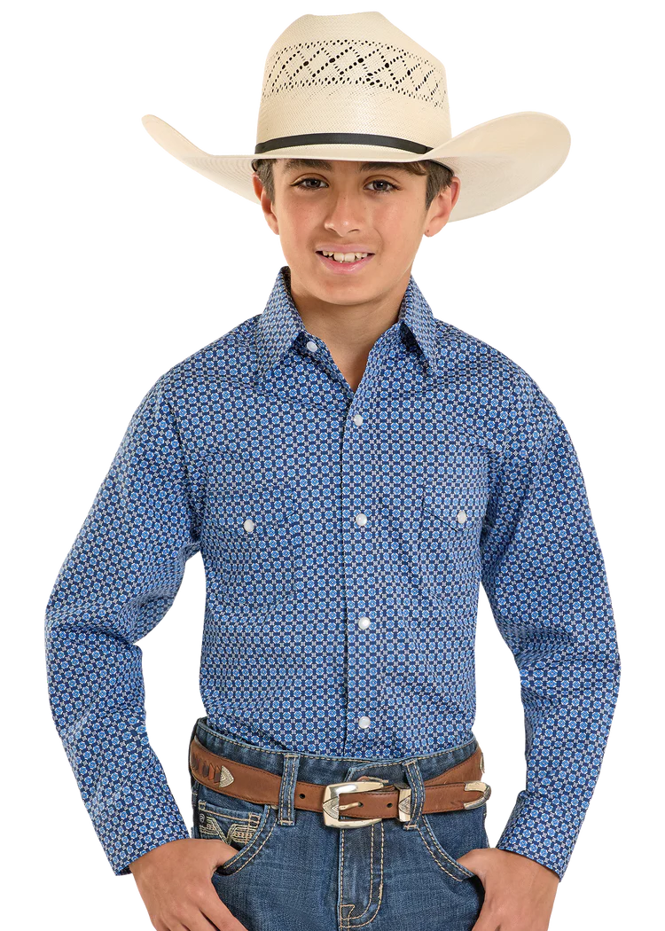 Child wearing a blue patterned shirt, jeans, and a cowboy hat on a white background