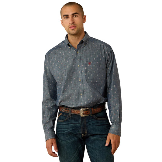 Man wearing a patterned button-up shirt and jeans on a white background
