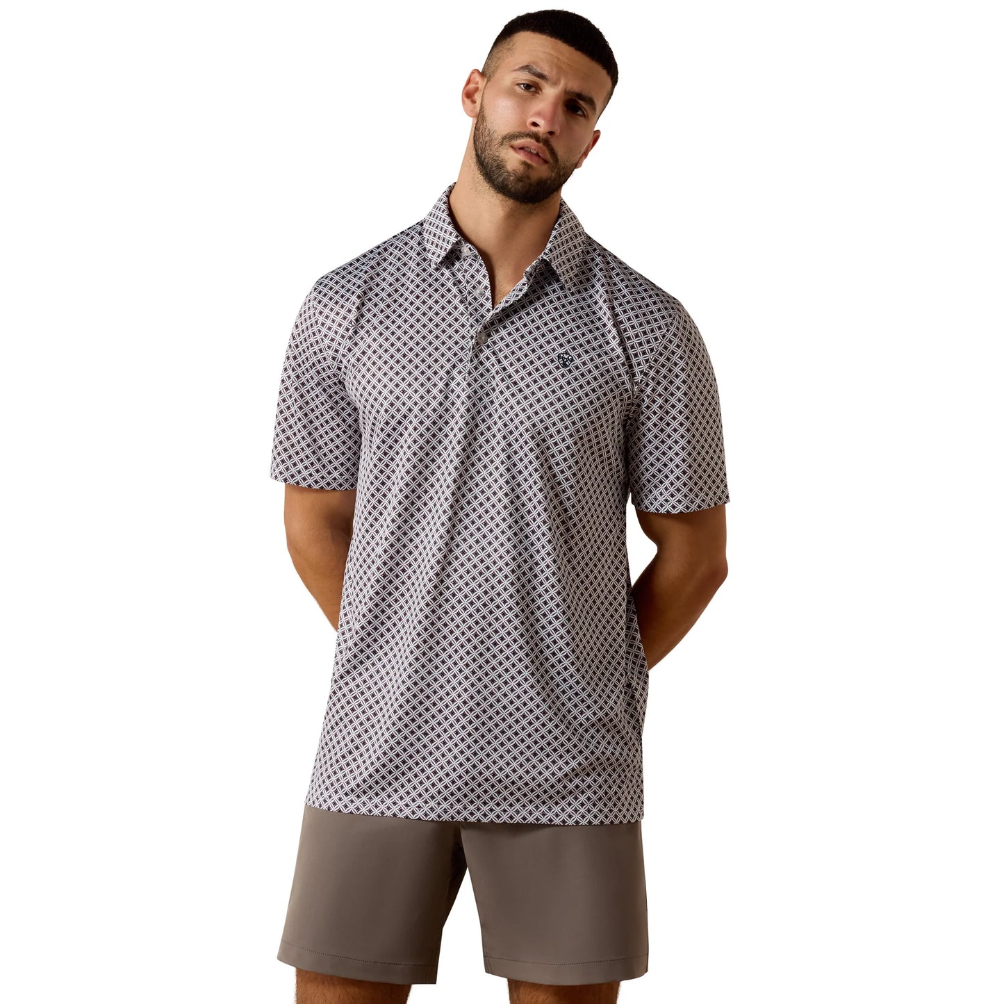 Man wearing a patterned polo shirt and shorts on a white background