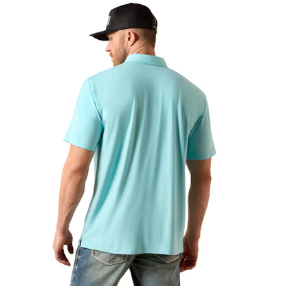 Man wearing a light blue polo shirt and black cap on a white background