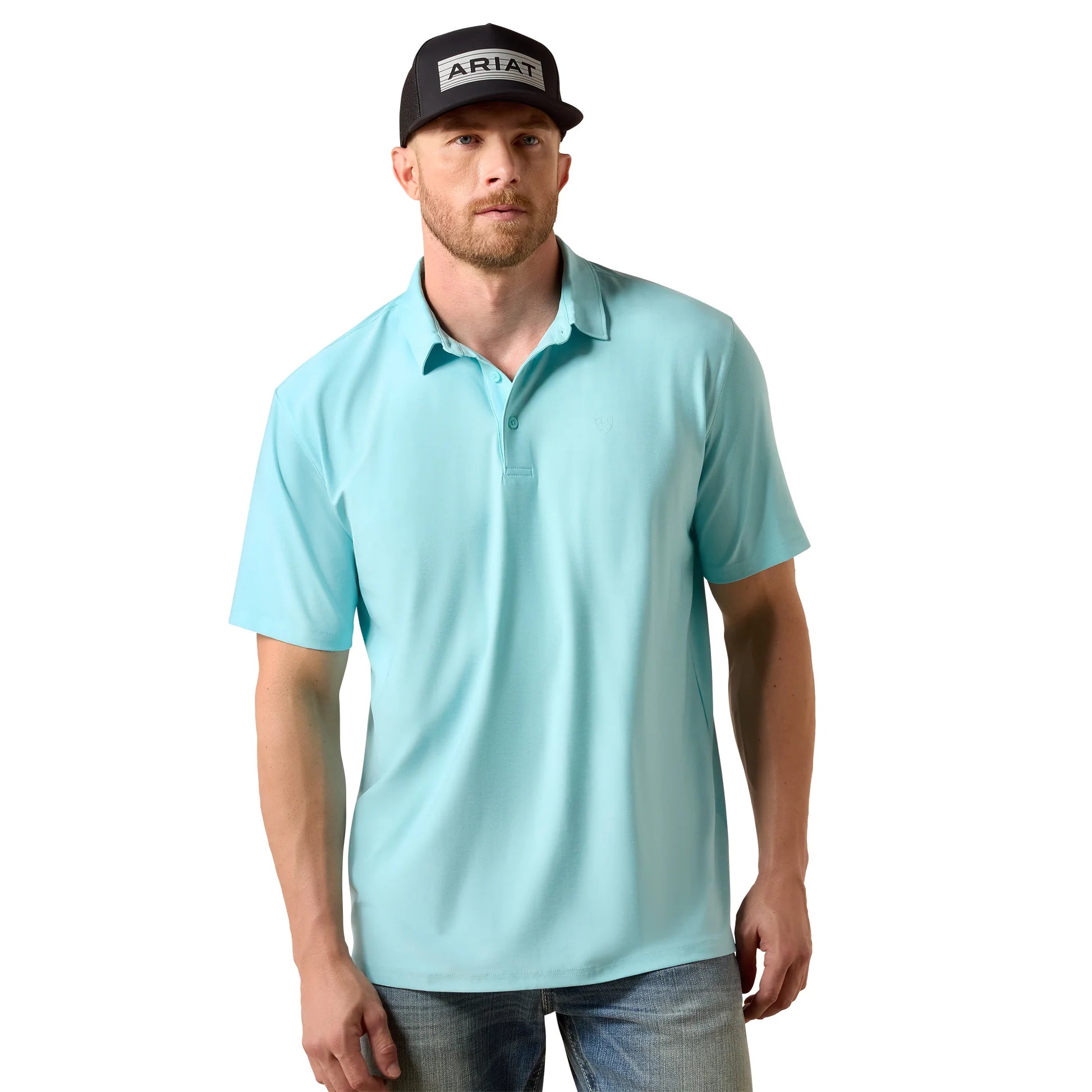 Man wearing a light blue polo shirt and black cap with 'Ariat' logo on a white background
