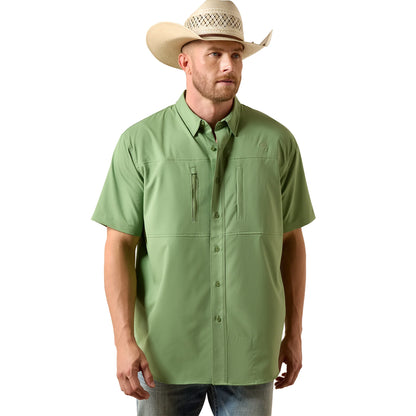 Man wearing a green shirt and cowboy hat on a white background