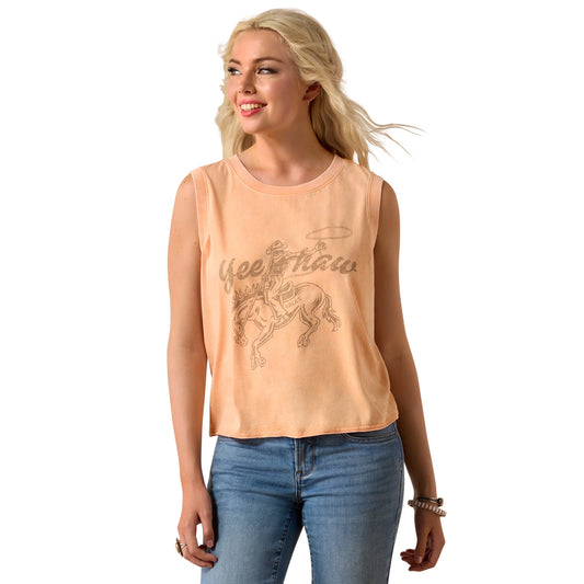 Woman wearing a peach sleeveless top with graphic design on a white background