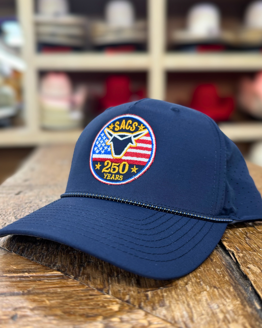 Blue cap with a logo on a wooden surface, with a blurred background of shelves with hats.