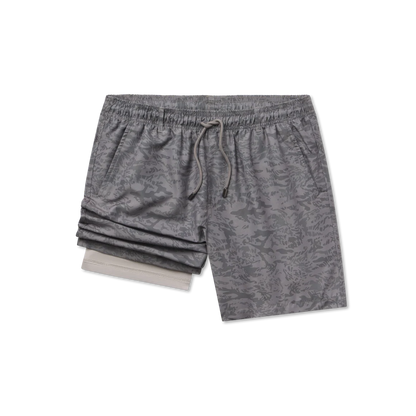 Gray camouflage shorts on a white background