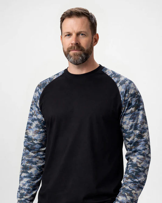 Man wearing a black shirt with blue camouflage sleeves on a white background