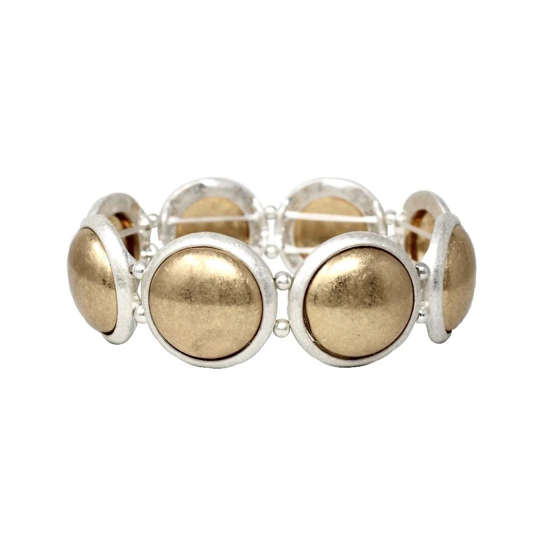Bracelet with gold and silver circular beads on a white background