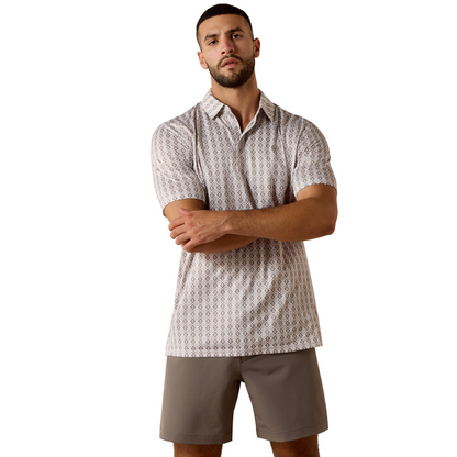 Man wearing a patterned shirt and shorts on a white background