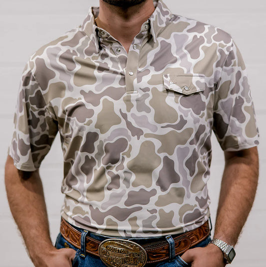 Person wearing a camouflage-patterned shirt with a plain background