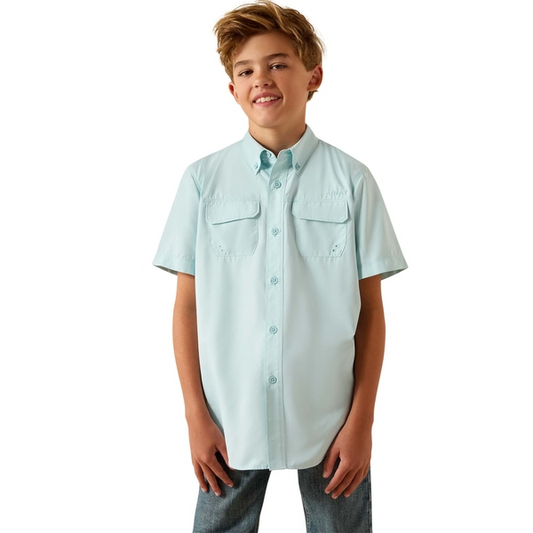 Boy wearing light blue short sleeve button-up shirt with front pockets
