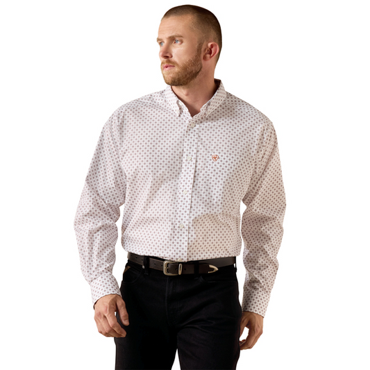 Man wearing a white patterned shirt with a logo on a white background
