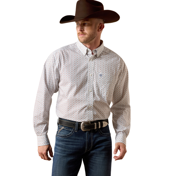 Man wearing a patterned shirt, jeans, and a cowboy hat on a white background