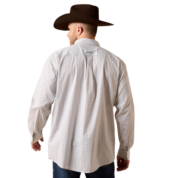 Man wearing a patterned shirt and cowboy hat on a white background