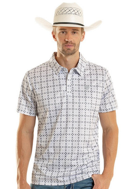 Man wearing a patterned short-sleeve shirt and white cowboy hat on a white background